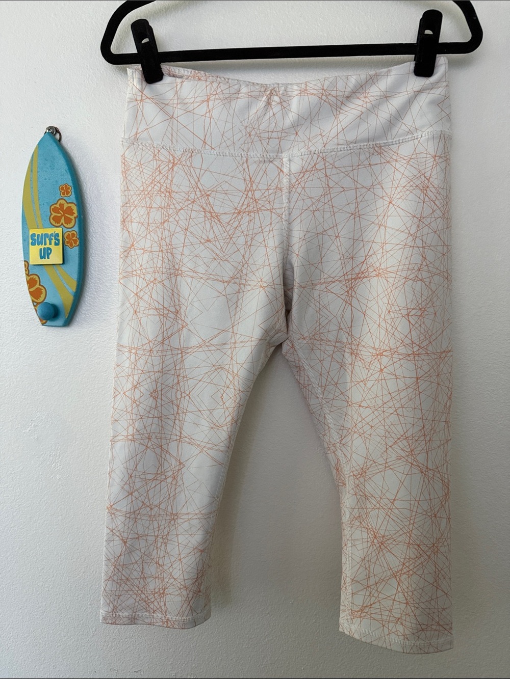 ALO Yoga White Capri Leggings with Orange Scribble Pattern